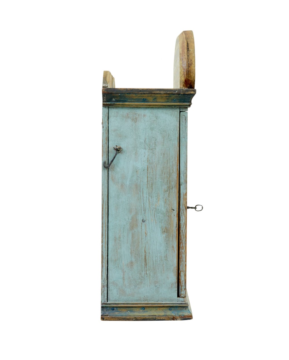 A 19th-century Finnish painted pine wall cupboard featuring weathered light blue paint, an arched pediment crest, and a door panel carved with a diamond pattern. View V