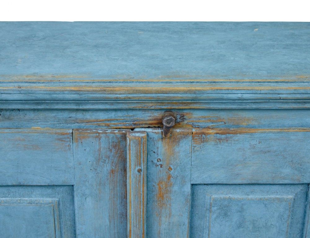 A 19th-century Swedish pine cupboard featuring a painted light blue distressed finish, double panelled doors, and top iron latch. View IV