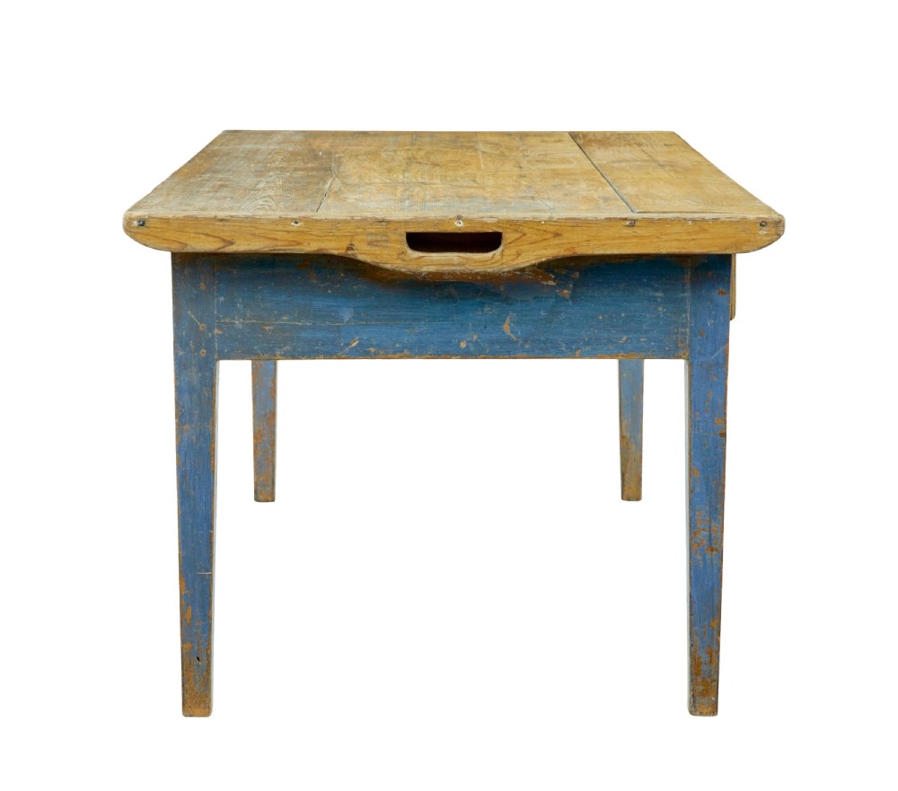 A 19th-century Scandinavian bakers table featuring a distressed blue painted base, two front drawers with brass drop handles, and an unpainted pine top with raised side lips. View VII
