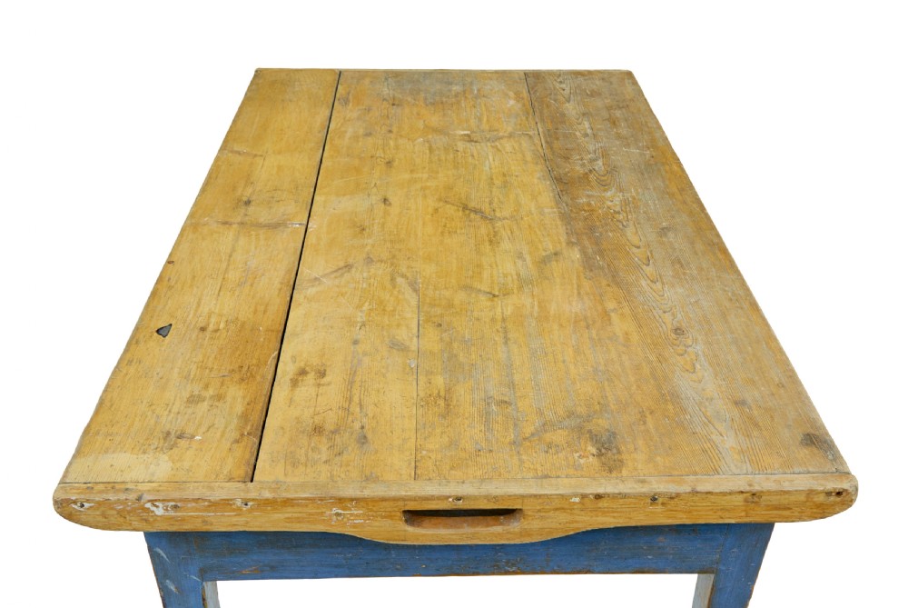 A 19th-century Scandinavian bakers table featuring a distressed blue painted base, two front drawers with brass drop handles, and an unpainted pine top with raised side lips. View IX