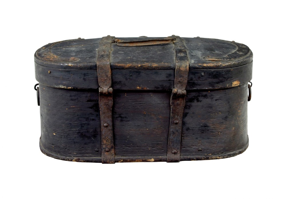 An oval 19th-century Swedish black painted wooden box featuring hand-forged iron straps, side carrying rings, and a key inserted into the central escutcheon. View III