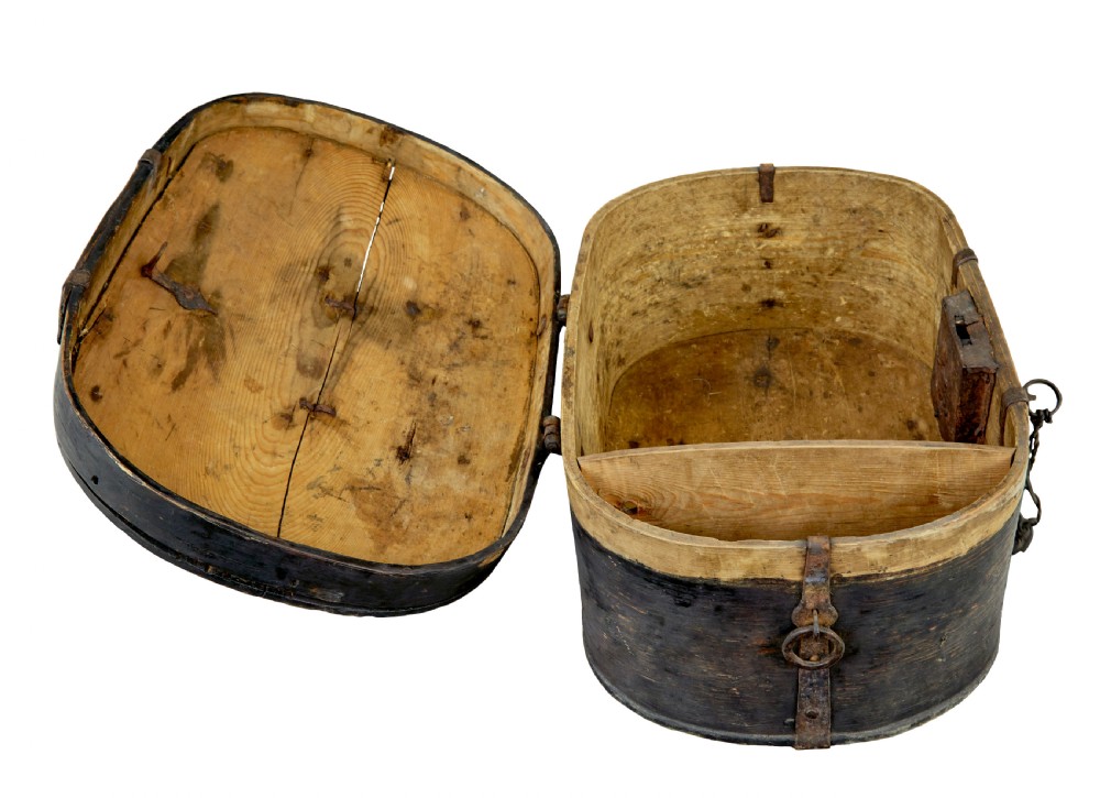 An oval 19th-century Swedish black painted wooden box featuring hand-forged iron straps, side carrying rings, and a key inserted into the central escutcheon. View VI