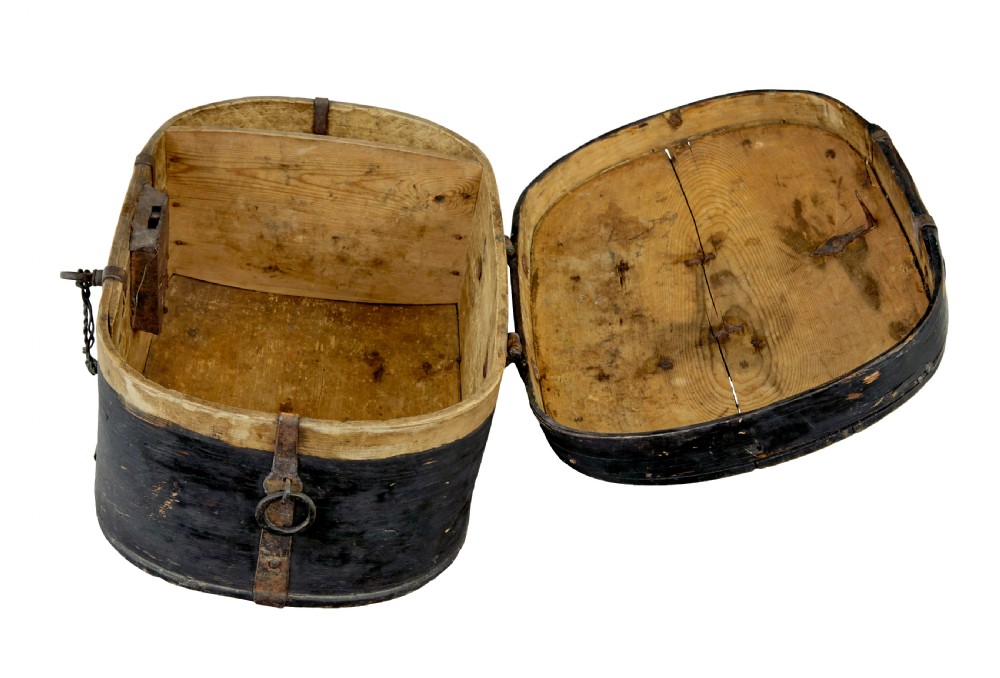 An oval 19th-century Swedish black painted wooden box featuring hand-forged iron straps, side carrying rings, and a key inserted into the central escutcheon. View VII