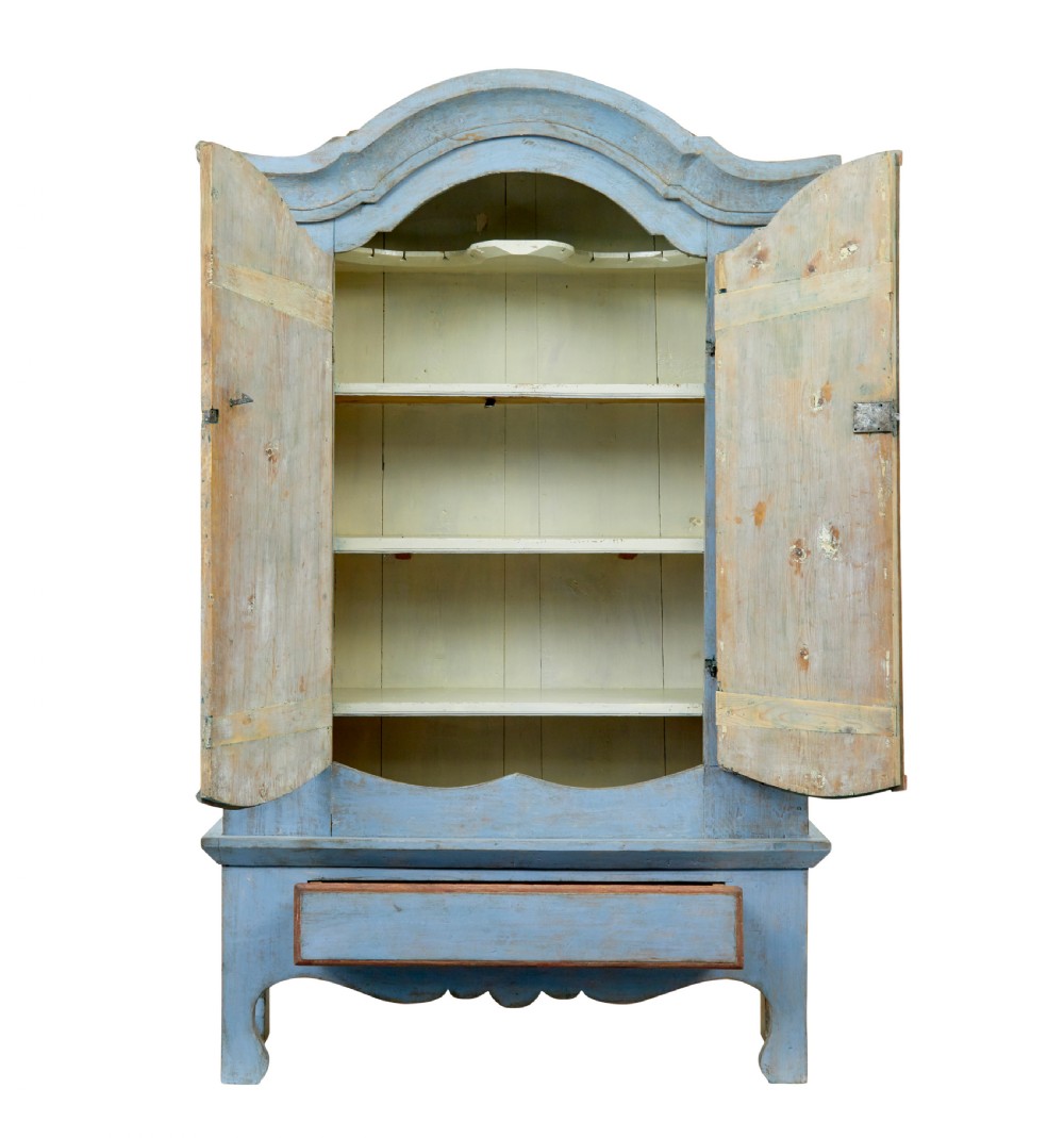 A nineteenth-century Swedish painted pine cupboard on stand, finished in light blue paint with red-trimmed panel doors and a lower drawer. View III