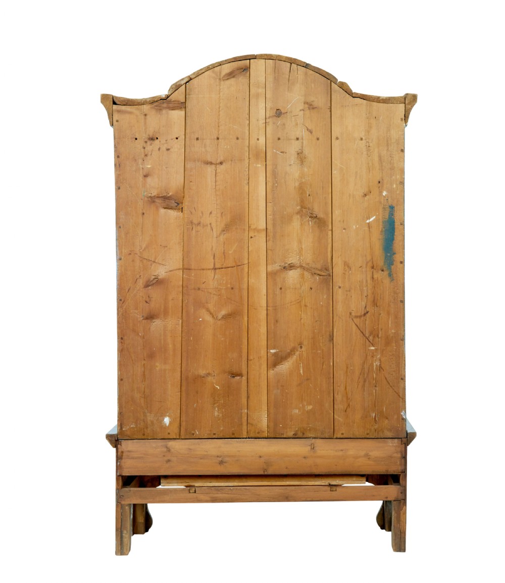 A nineteenth-century Swedish painted pine cupboard on stand, finished in light blue paint with red-trimmed panel doors and a lower drawer. View V