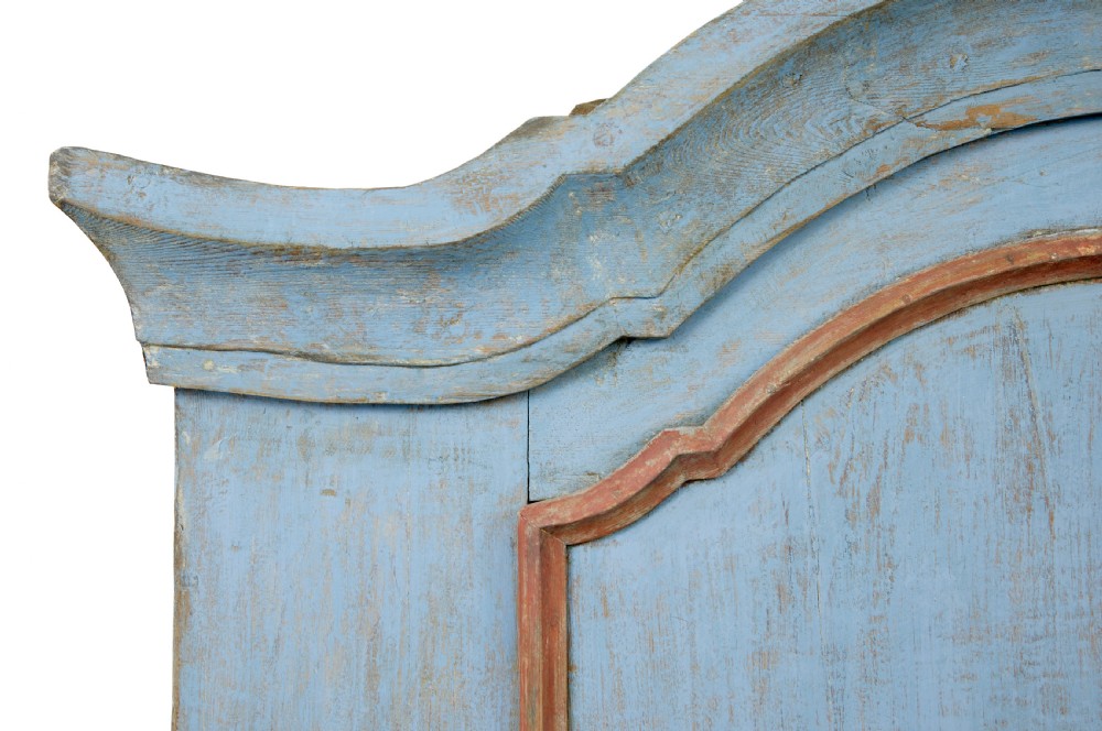 A nineteenth-century Swedish painted pine cupboard on stand, finished in light blue paint with red-trimmed panel doors and a lower drawer. View VII