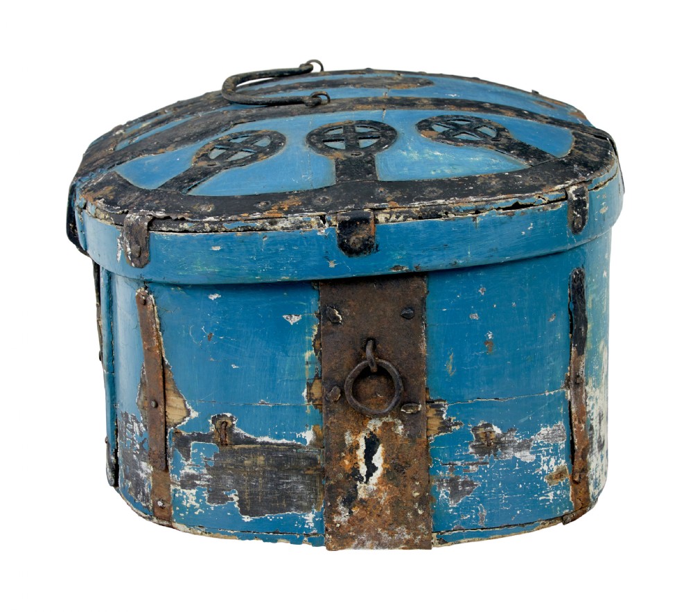 A 19th-century oval wooden strong box featuring distressed blue paint, hand-forged black iron straps, and a central keyhole escutcheon. View VII