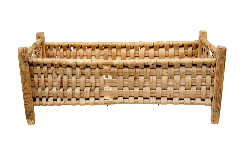 A rectangular hand-woven pine splint basket featuring four raised wooden corner posts and woven timber strips. View V