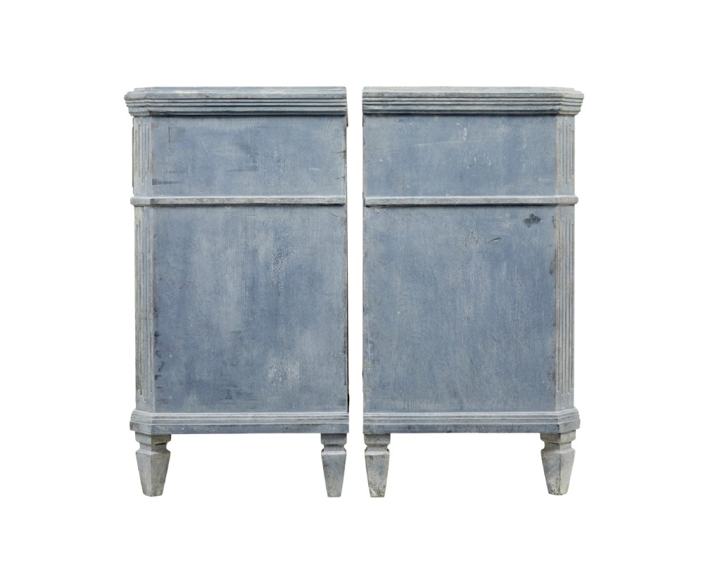 A pair of 19th-century Swedish Gustavian influenced three-drawer chests of drawers with a muted grey-blue painted finish and brass ring handles. View IV