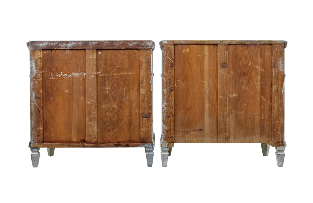 A pair of 19th-century Swedish Gustavian influenced three-drawer chests of drawers with a muted grey-blue painted finish and brass ring handles. View VI