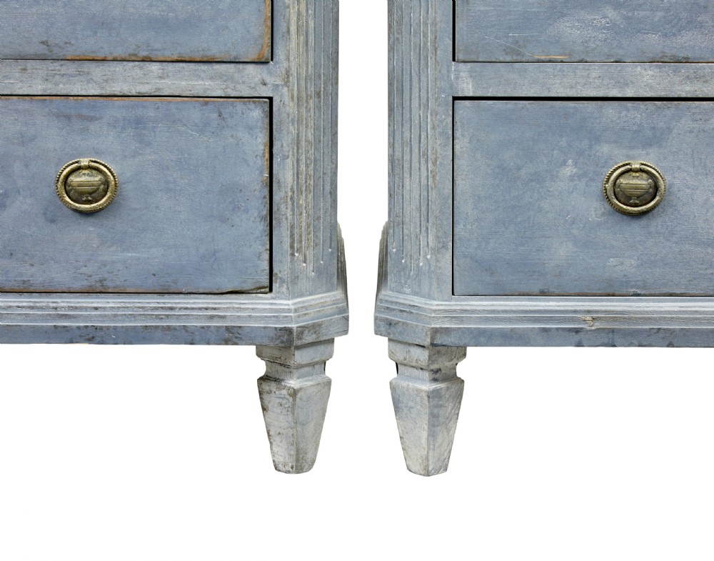 A pair of 19th-century Swedish Gustavian influenced three-drawer chests of drawers with a muted grey-blue painted finish and brass ring handles. View VII