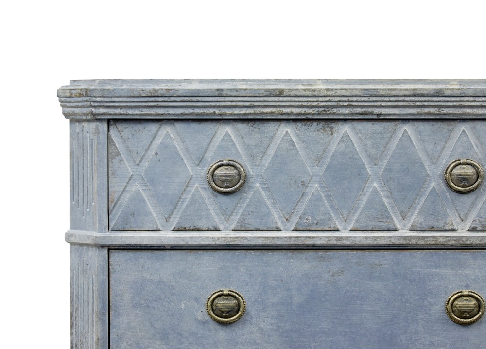 A pair of 19th-century Swedish Gustavian influenced three-drawer chests of drawers with a muted grey-blue painted finish and brass ring handles. View VIII