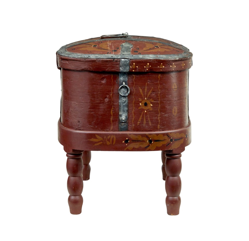 A Swedish folk art painted wooden coffer on turned legs, decorated with red paint, floral motifs, iron straps, and a painted 1827 date. View VI