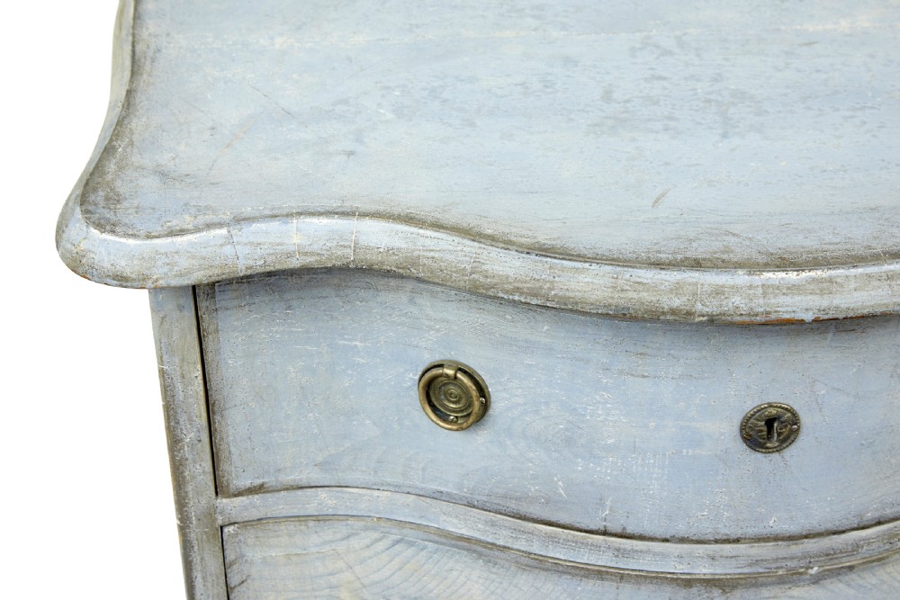 A pair of 19th-century Swedish three-drawer commodes featuring distressed pale blue painted finishes, cabriole legs, and brass hardware. View IV