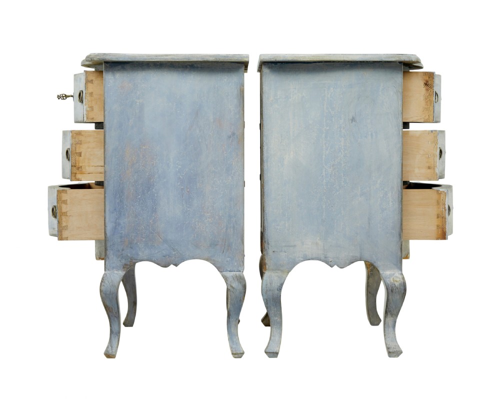 A pair of 19th-century Swedish three-drawer commodes featuring distressed pale blue painted finishes, cabriole legs, and brass hardware. View VII