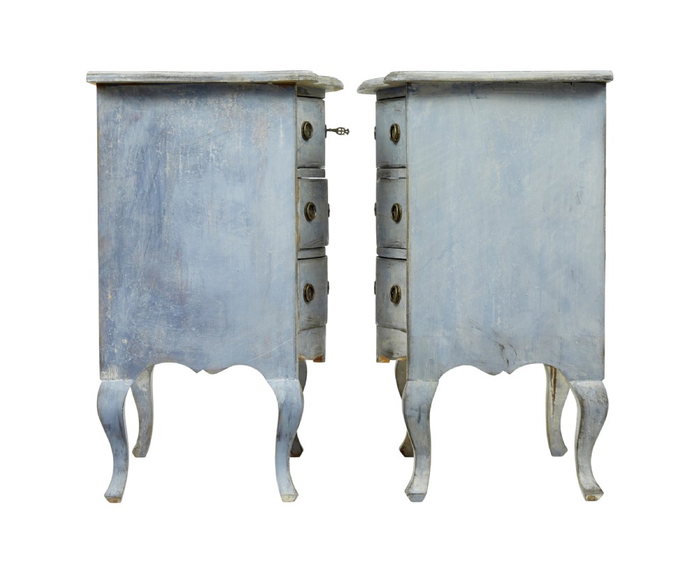 A pair of 19th-century Swedish three-drawer commodes featuring distressed pale blue painted finishes, cabriole legs, and brass hardware. View IX