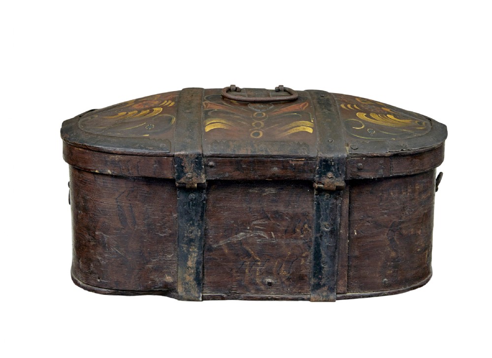 An oval dark brown 19th-century wooden box featuring hand-painted yellow and red floral folk motifs with iron bands and a latch. View IV