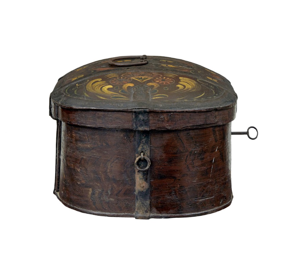 An oval dark brown 19th-century wooden box featuring hand-painted yellow and red floral folk motifs with iron bands and a latch. View V