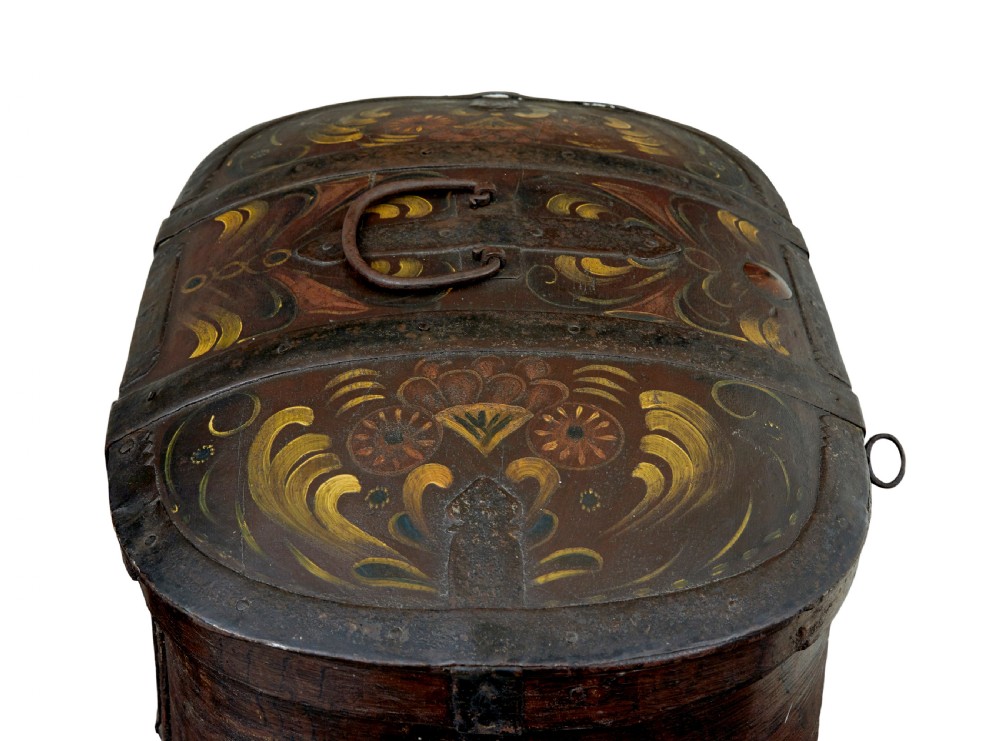 An oval dark brown 19th-century wooden box featuring hand-painted yellow and red floral folk motifs with iron bands and a latch. View VI