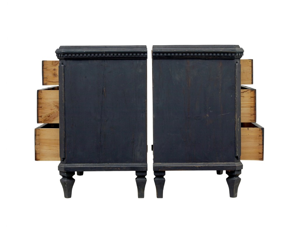 A matching pair of 19th-century Swedish black painted pine commodes, each featuring three drawers with moulded geometric panel fronts and brass drop handles. View III
