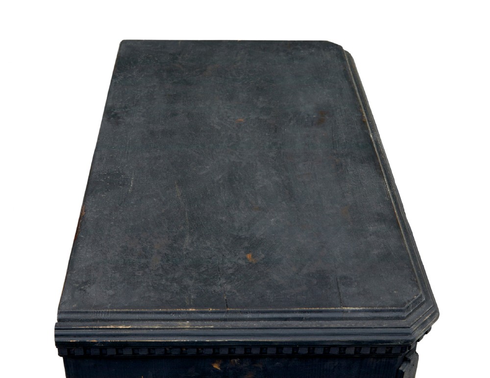 A matching pair of 19th-century Swedish black painted pine commodes, each featuring three drawers with moulded geometric panel fronts and brass drop handles. View VII