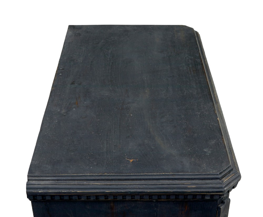 A matching pair of 19th-century Swedish black painted pine commodes, each featuring three drawers with moulded geometric panel fronts and brass drop handles. View VIII