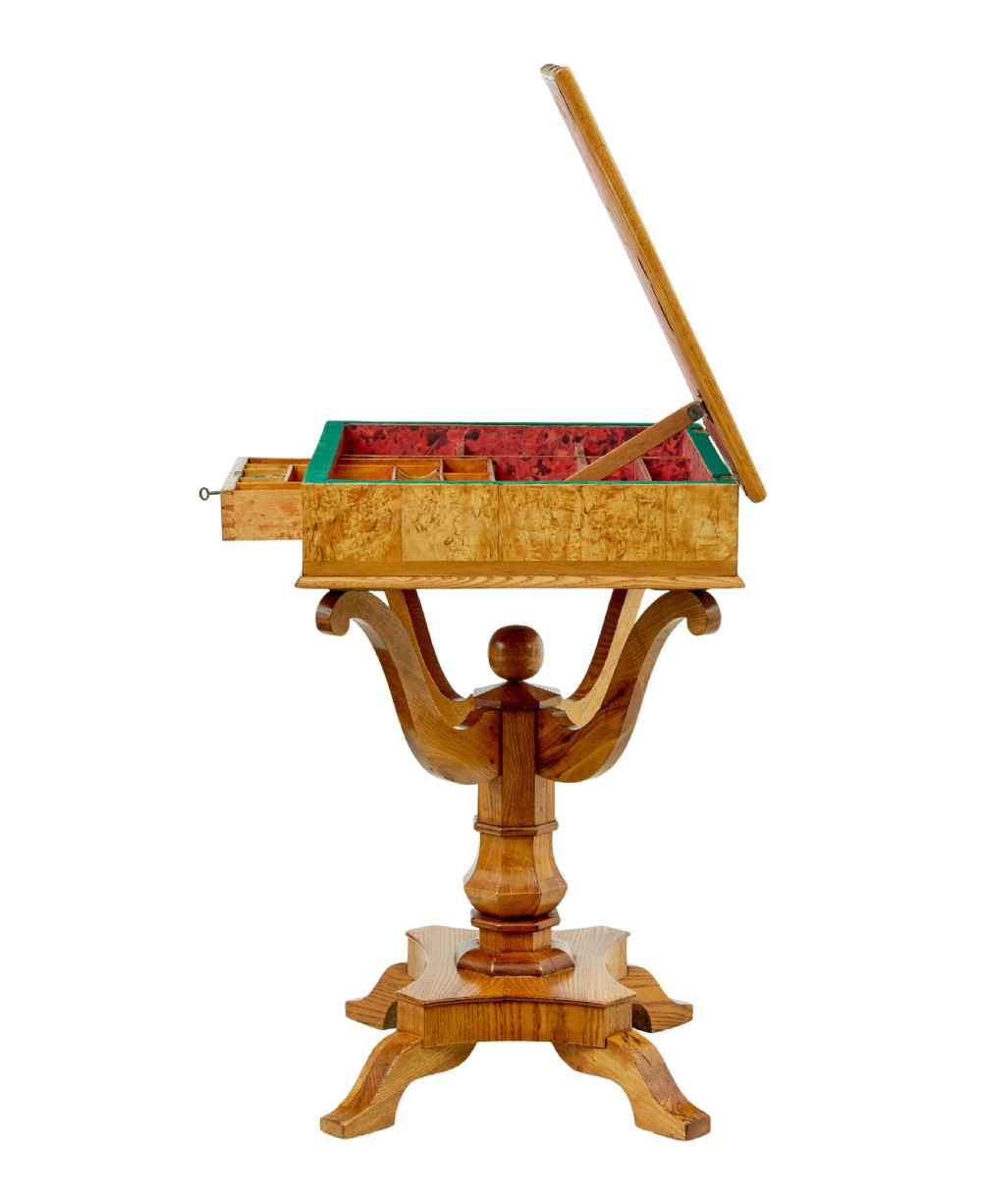 A 19th-century Scandinavian occasional table made of burr birch and elm with a single drawer, S-curved supports, a turned central pedestal, and a four-footed base. View V