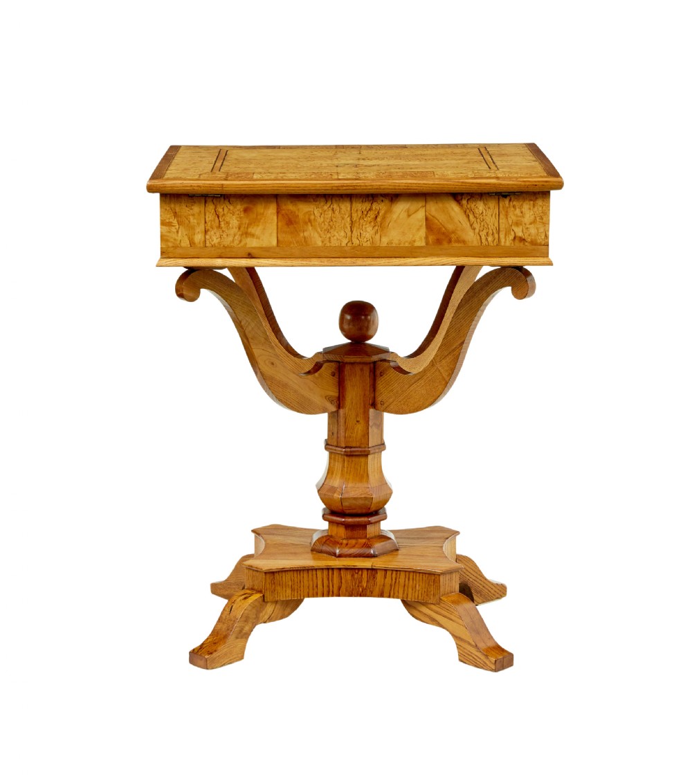 A 19th-century Scandinavian occasional table made of burr birch and elm with a single drawer, S-curved supports, a turned central pedestal, and a four-footed base. View VI