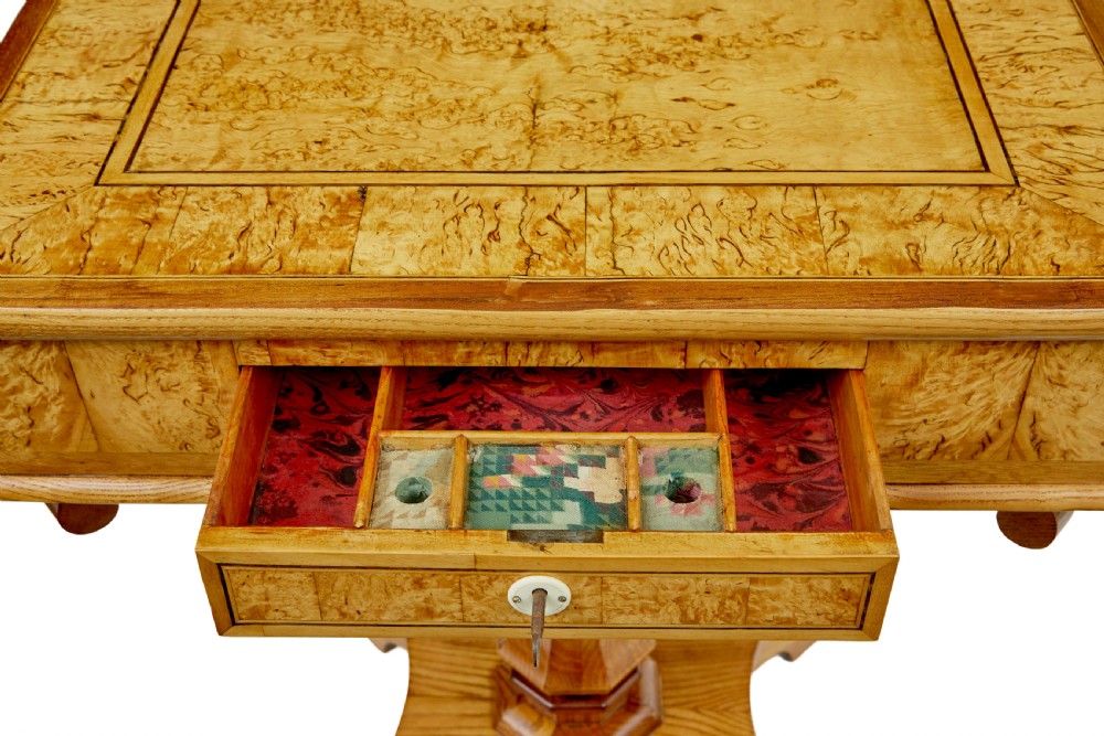 A 19th-century Scandinavian occasional table made of burr birch and elm with a single drawer, S-curved supports, a turned central pedestal, and a four-footed base. View VIII