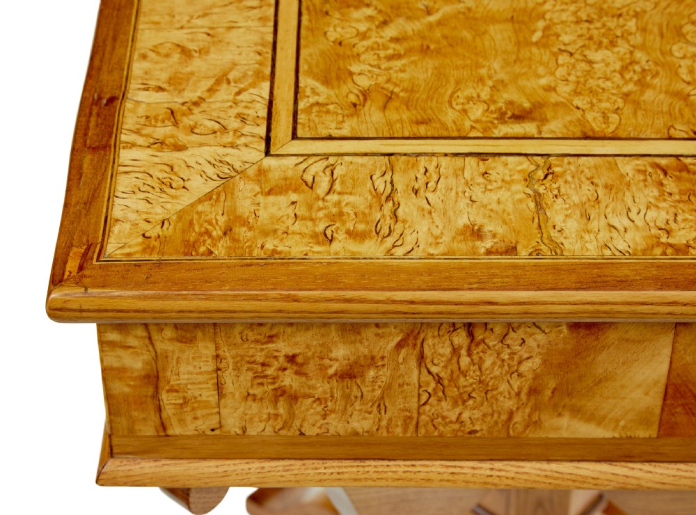 A 19th-century Scandinavian occasional table made of burr birch and elm with a single drawer, S-curved supports, a turned central pedestal, and a four-footed base. View XII