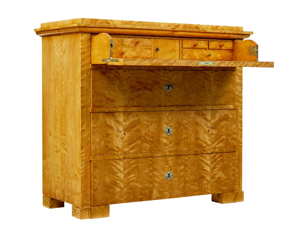 A 19th-century Swedish Biedermeier chest of drawers crafted from flame birch veneer with four horizontal drawer fronts, metal escutcheons, and square block feet. View II