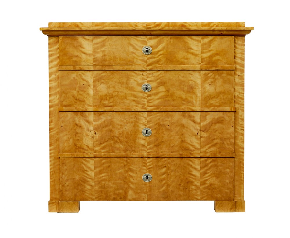 A 19th-century Swedish Biedermeier chest of drawers crafted from flame birch veneer with four horizontal drawer fronts, metal escutcheons, and square block feet. View III