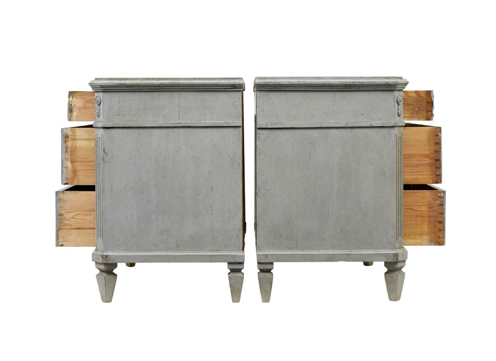 A pair of nineteenth-century Swedish Gustavian grey painted chests of drawers featuring Greek key frieze carving, fluted corners, and brass ring pulls. View III