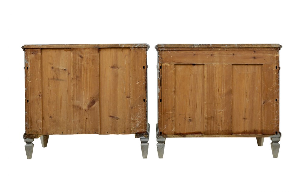 A pair of nineteenth-century Swedish Gustavian grey painted chests of drawers featuring Greek key frieze carving, fluted corners, and brass ring pulls. View IV