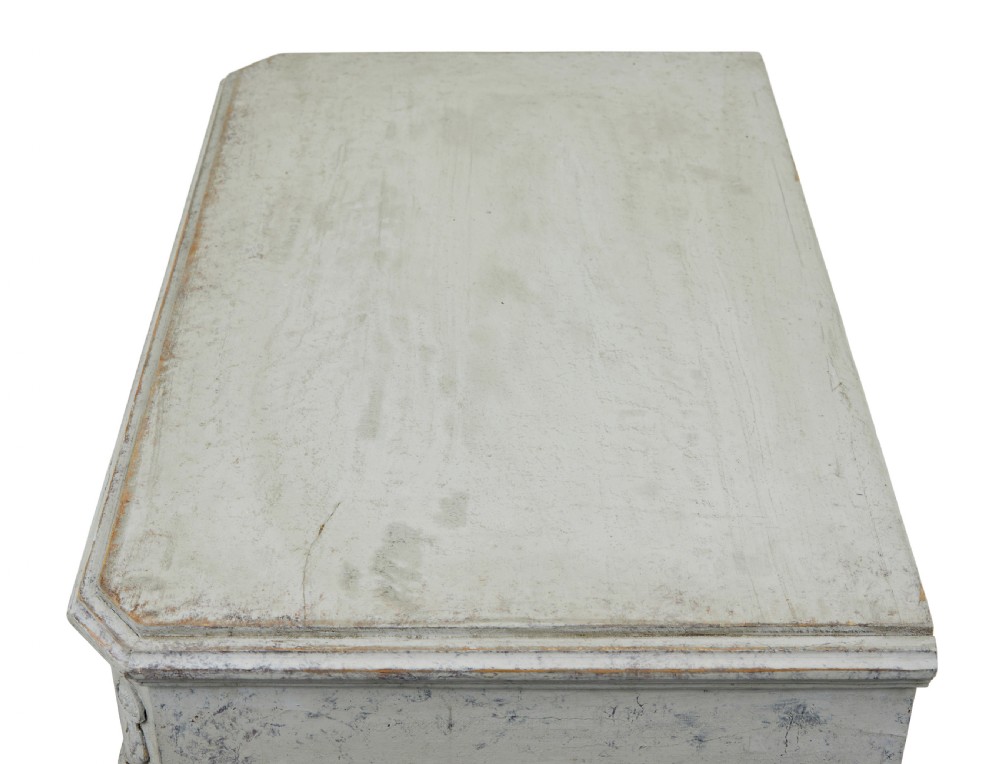 A pair of nineteenth-century Swedish Gustavian grey painted chests of drawers featuring Greek key frieze carving, fluted corners, and brass ring pulls. View IX