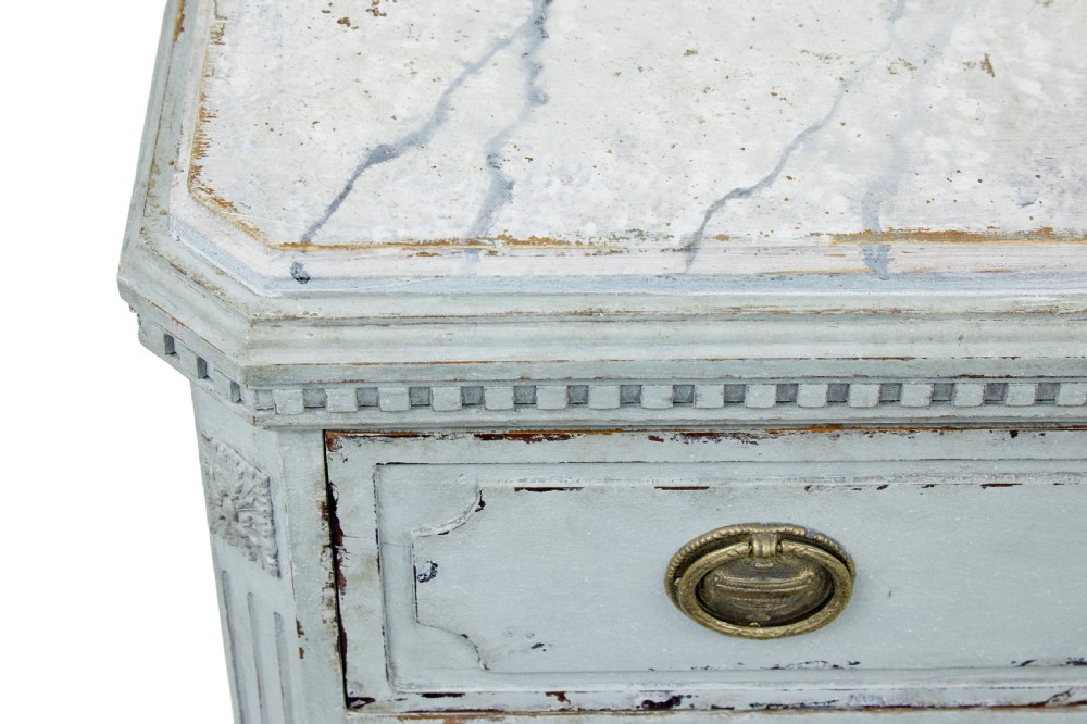 A pair of 19th-century pale blue-grey painted chests of drawers with three drawers each, brass ring handles, fluted corners, and faux marble tops. View IX