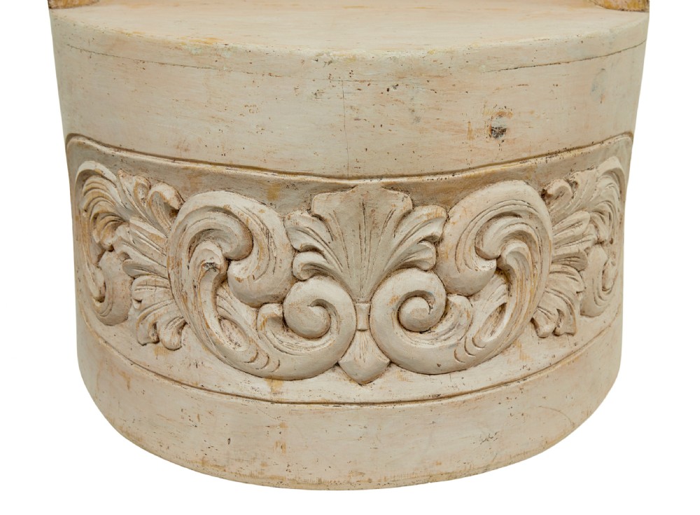 An antique cream-painted dugout armchair carved from a single timber section with relief floral scrollwork and hand-painted figures on the backrest. View III