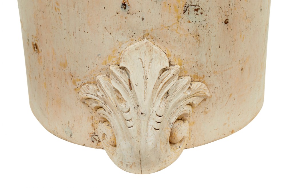 An antique cream-painted dugout armchair carved from a single timber section with relief floral scrollwork and hand-painted figures on the backrest. View VI