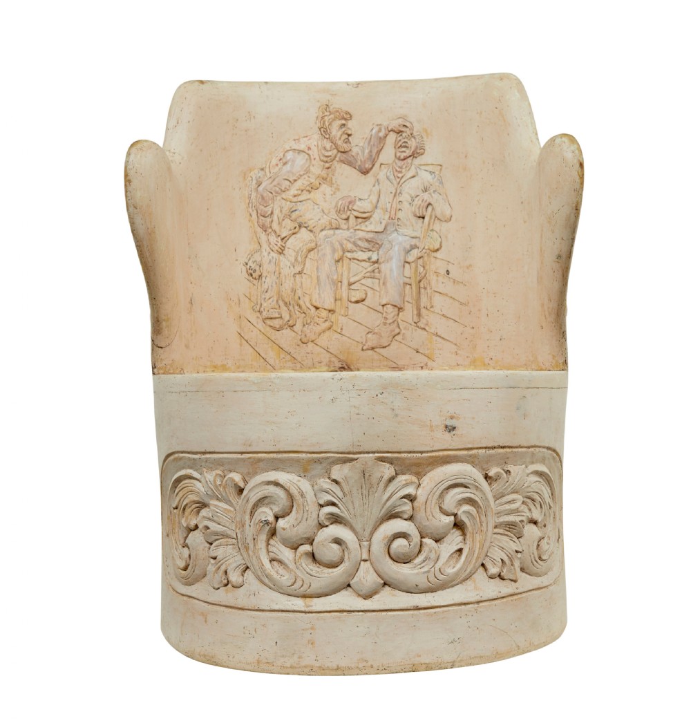 An antique cream-painted dugout armchair carved from a single timber section with relief floral scrollwork and hand-painted figures on the backrest. View XI