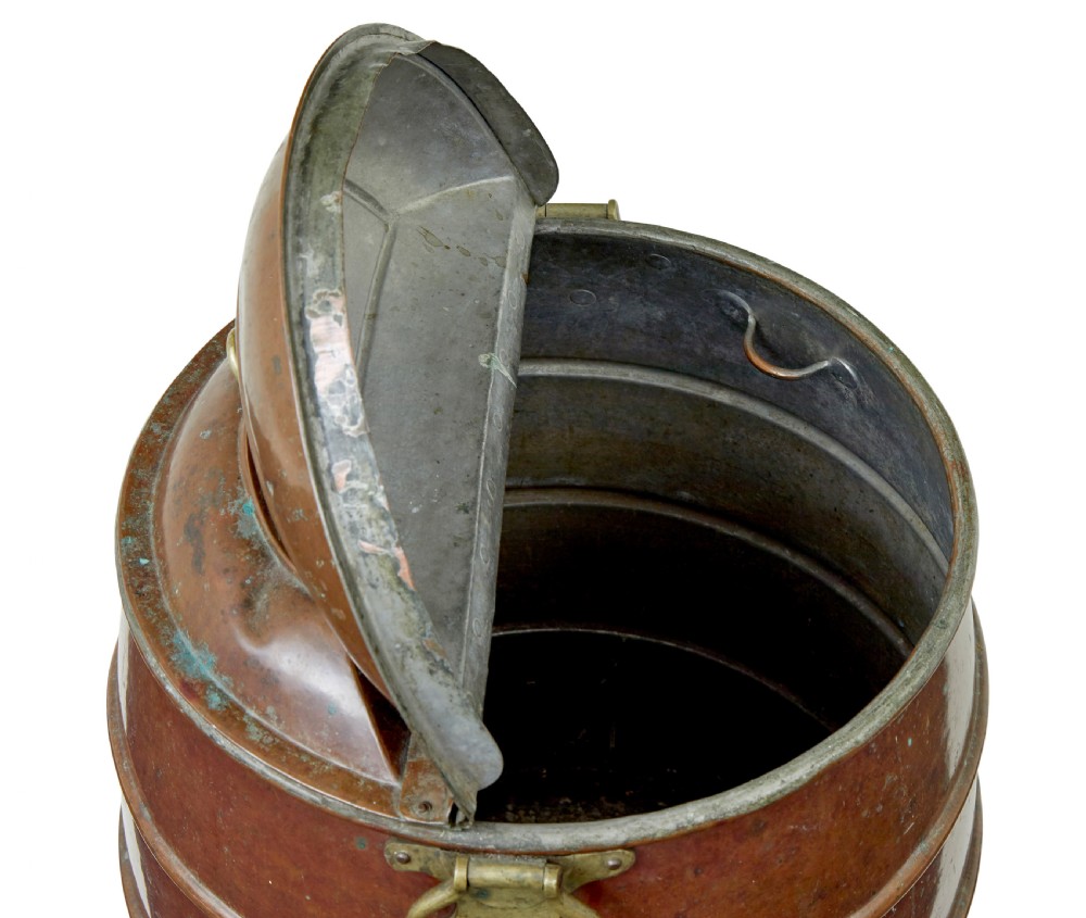 A nineteenth-century barrel-shaped copper water container with horizontal bands, brass handles, and a fitted lid. View VIII