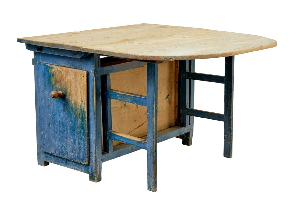 A 19th-century Swedish pine drop-leaf table featuring a raw timber top and a distressed blue painted base with a hinged leaf mechanism.