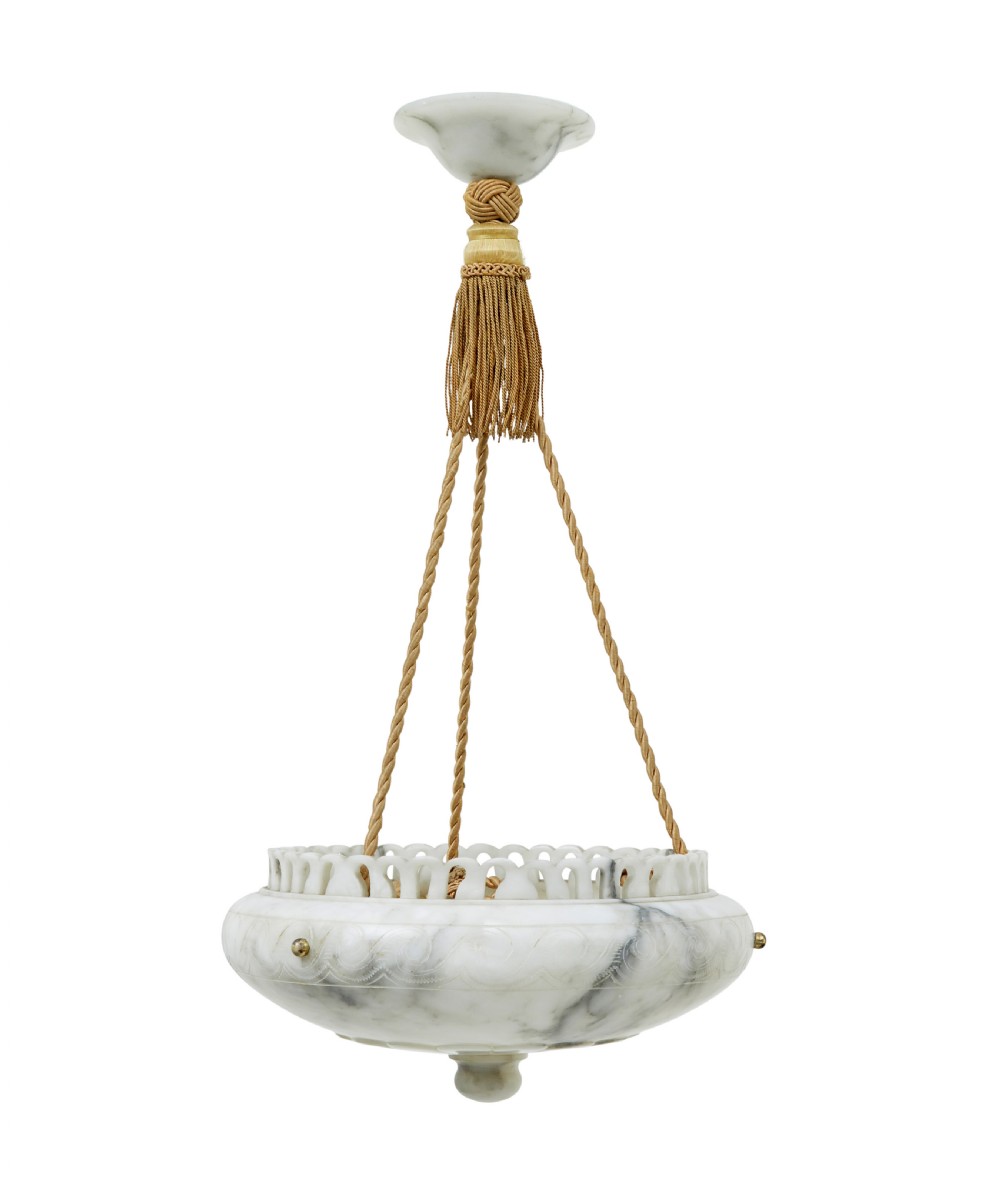 A hand-carved off-white alabaster bowl ceiling light suspended by braided cords with a decorative tassel and matching top rose.