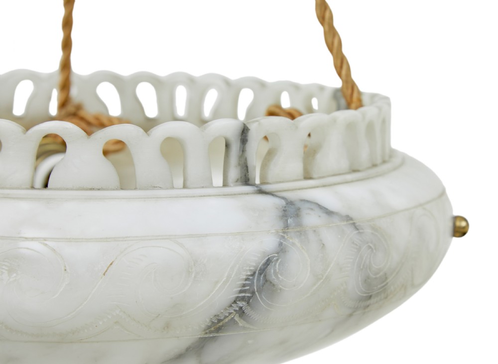 A hand-carved off-white alabaster bowl ceiling light suspended by braided cords with a decorative tassel and matching top rose. View IV