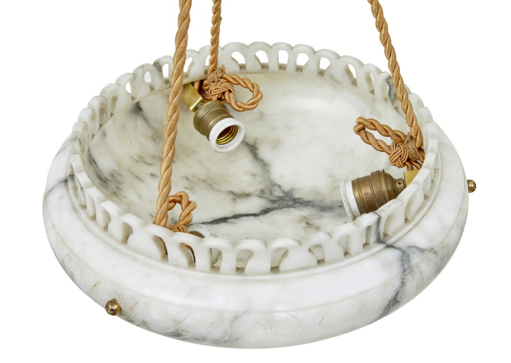 A hand-carved off-white alabaster bowl ceiling light suspended by braided cords with a decorative tassel and matching top rose. View V