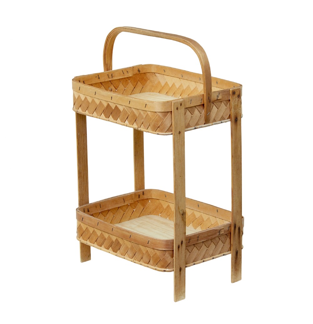 An early twentieth-century two-tier stand constructed from light-coloured woven pine splints with a bentwood arch handle and straight timber legs. View V