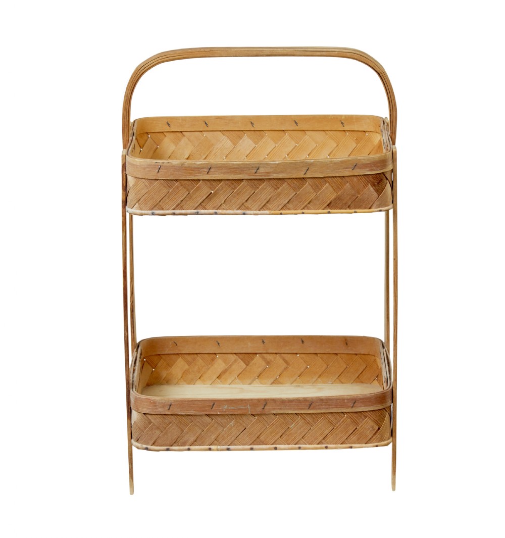 An early twentieth-century two-tier stand constructed from light-coloured woven pine splints with a bentwood arch handle and straight timber legs. View VII