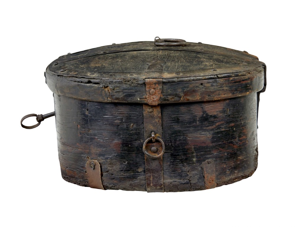 A mid-19th century Swedish oval pine strong box with dark painted finish and iron strapping. View II