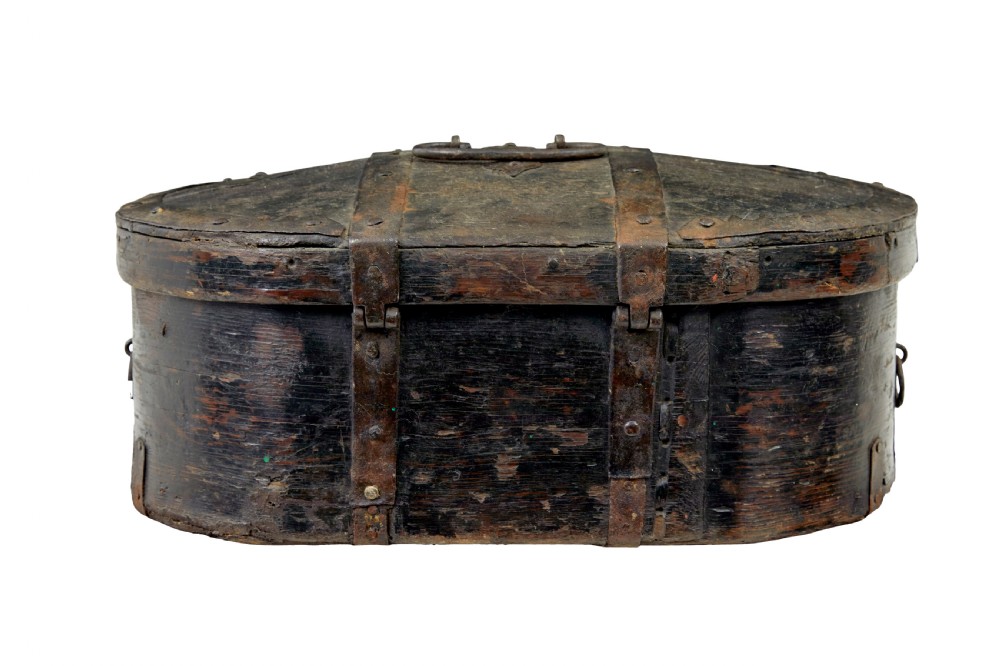 A mid-19th century Swedish oval pine strong box with dark painted finish and iron strapping. View III
