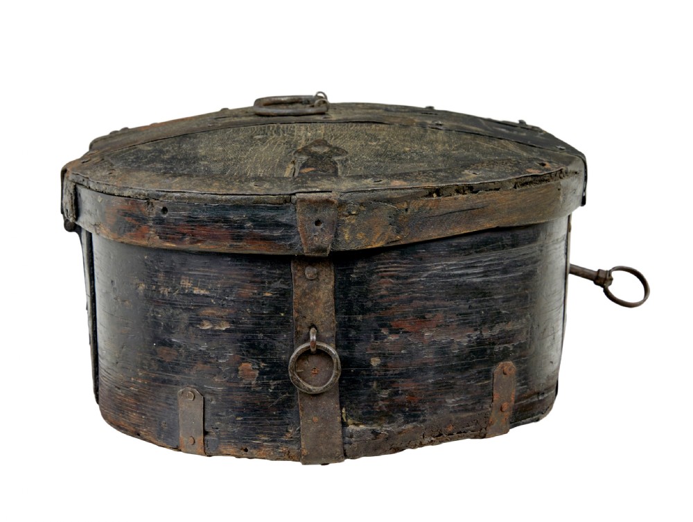 A mid-19th century Swedish oval pine strong box with dark painted finish and iron strapping. View IV