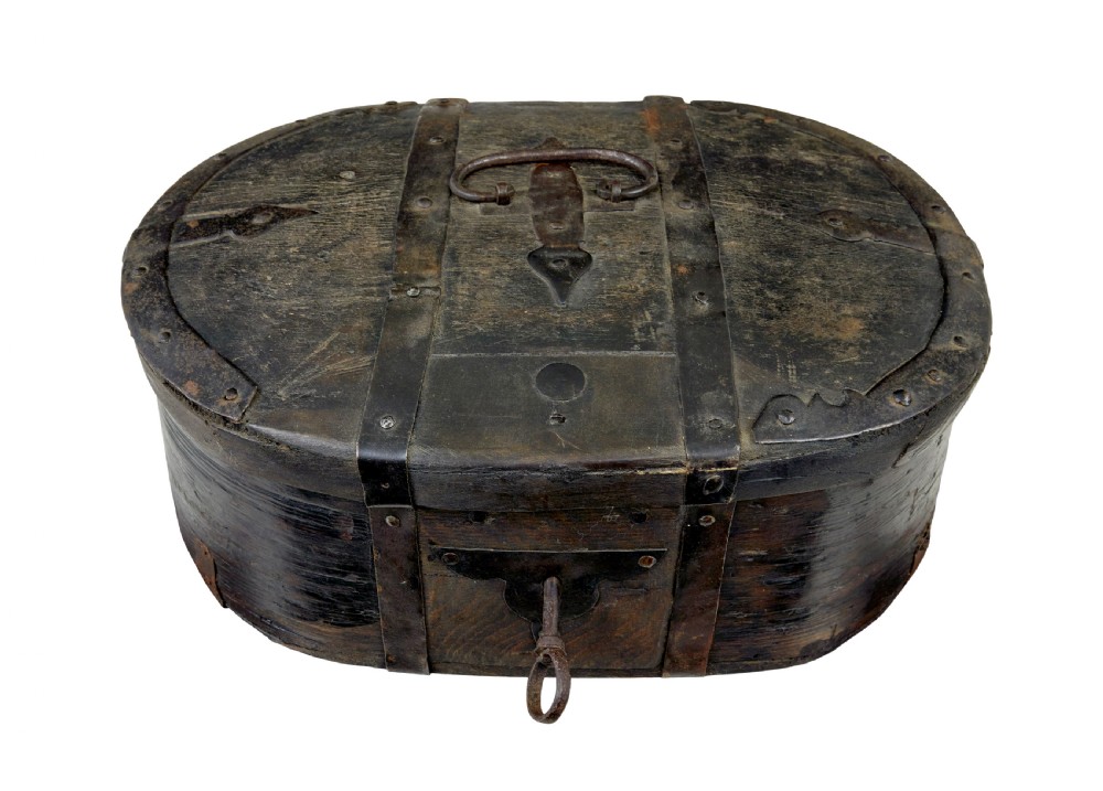 A mid-19th century Swedish oval pine strong box with dark painted finish and iron strapping. View VI